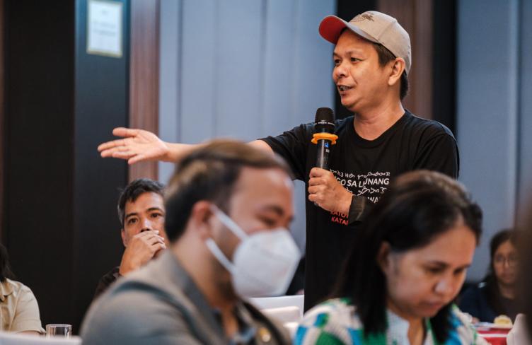 Civil society participant shares views at meeting